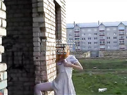 Настёна у заброшенного здания